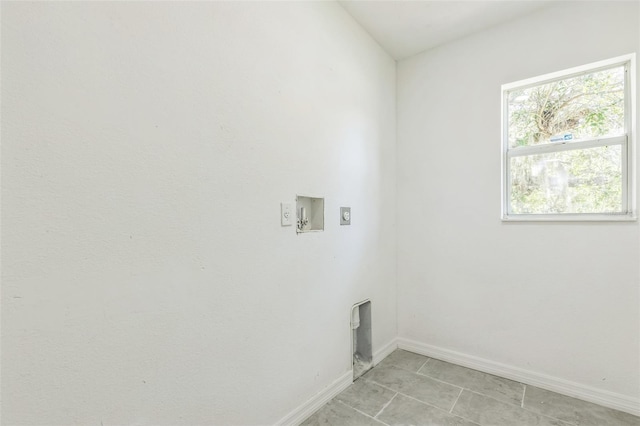 4957 N Cranberry Blvd, North Port, FL 34286 - laundry area featuring electric dryer hookup, hookup for a washing machine, and light tile patterned floors