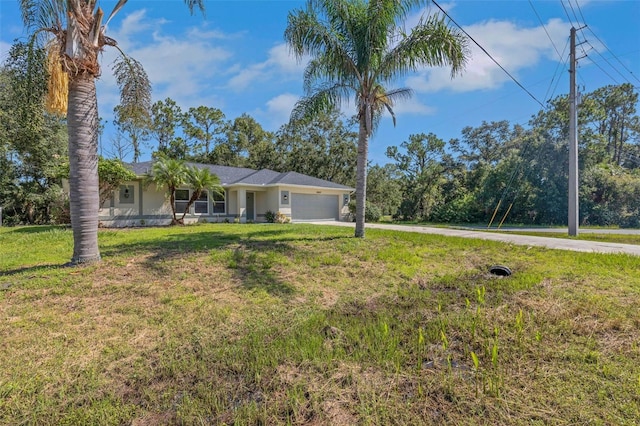 4957 N Cranberry Blvd, North Port, FL 34286 - view of front of property with a garage, driveway, and a front yard