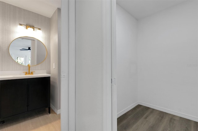 4957 N Cranberry Blvd, North Port, FL 34286 - bathroom featuring wood finished floors, vanity, and ceiling fan