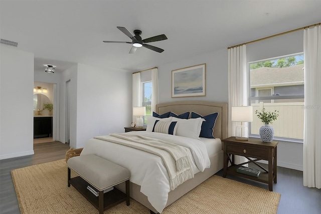 4957 N Cranberry Blvd, North Port, FL 34286 - bedroom with wood finished floors, connected bathroom, and ceiling fan