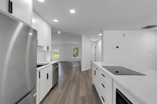 4957 N Cranberry Blvd, North Port, FL 34286 - kitchen featuring stainless steel appliances, recessed lighting, dark wood finished floors, light stone countertops, and white cabinetry