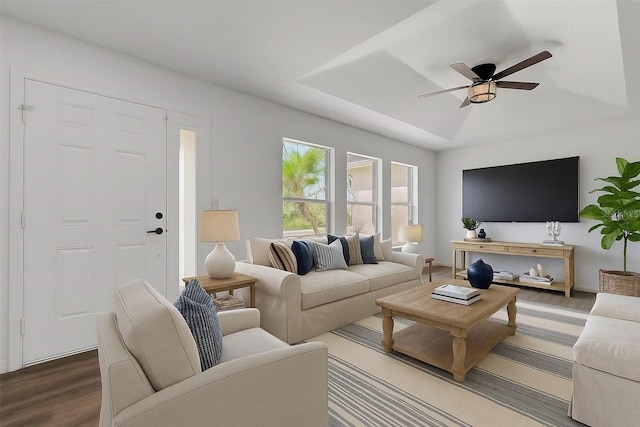 4957 N Cranberry Blvd, North Port, FL 34286 - living area featuring wood finished floors, a raised ceiling, and a ceiling fan
