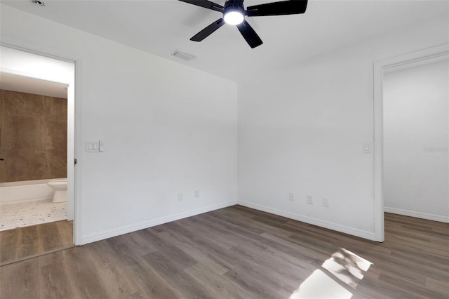 4957 N Cranberry Blvd, North Port, FL 34286 - unfurnished bedroom with wood finished floors, ensuite bathroom, and a ceiling fan