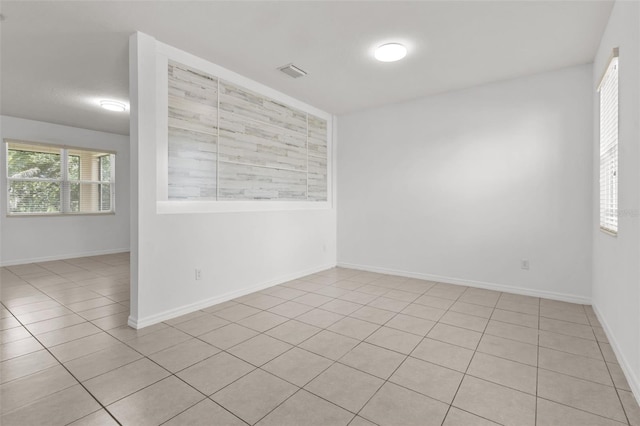 12124 Lake Blvd, Trinity, FL 34655 - tiled spare room featuring baseboards