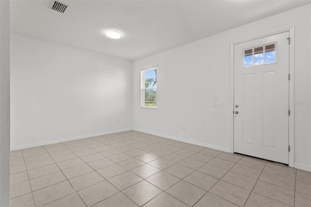 12124 Lake Blvd, Trinity, FL 34655 - foyer featuring baseboards and light tile patterned flooring