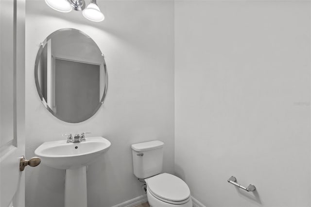 12124 Lake Blvd, Trinity, FL 34655 - bathroom with toilet and baseboards