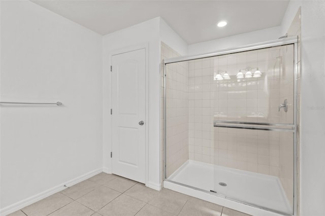 12124 Lake Blvd, Trinity, FL 34655 - full bathroom with a stall shower and tile patterned floors