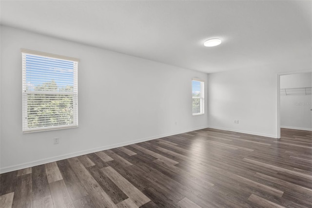 12124 Lake Blvd, Trinity, FL 34655 - spare room featuring dark wood-type flooring