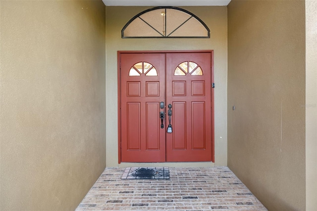 1304 N Jasmine Ave, Tarpon Springs, FL 34689 - property entrance with stucco siding