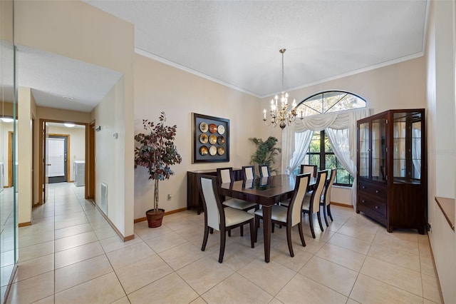 1304 N Jasmine Ave, Tarpon Springs, FL 34689 - dining room with a chandelier, light tile patterned flooring, crown molding, and a textured ceiling