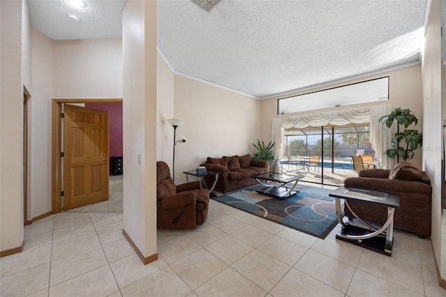 1304 N Jasmine Ave, Tarpon Springs, FL 34689 - living room featuring a textured ceiling, crown molding, light tile patterned flooring, and a towering ceiling