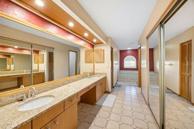 1304 N Jasmine Ave, Tarpon Springs, FL 34689 - bathroom featuring double vanity, recessed lighting, and a closet