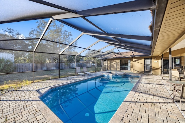 1304 N Jasmine Ave, Tarpon Springs, FL 34689 - view of swimming pool featuring a patio area, a pool with connected hot tub, and glass enclosure