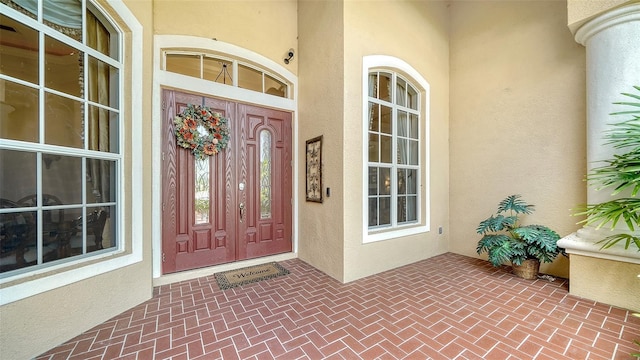 15110 Sundial Pl, Lakewood Ranch, FL 34202 - view of exterior entry featuring stucco siding and covered porch