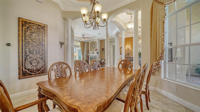 15110 Sundial Pl, Lakewood Ranch, FL 34202 - dining space with ornate columns, ornamental molding, arched walkways, light tile patterned floors, and ceiling fan