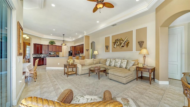 15110 Sundial Pl, Lakewood Ranch, FL 34202 - living area featuring arched walkways, ornamental molding, a ceiling fan, recessed lighting, and light tile patterned floors