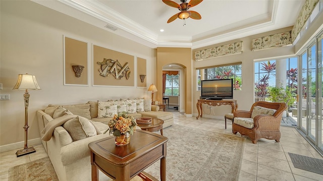 15110 Sundial Pl, Lakewood Ranch, FL 34202 - living area featuring arched walkways, a ceiling fan, plenty of natural light, crown molding, and a high ceiling