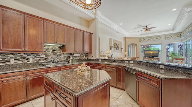 15110 Sundial Pl, Lakewood Ranch, FL 34202 - kitchen with appliances with stainless steel finishes, a peninsula, decorative backsplash, ceiling fan, and ornamental molding