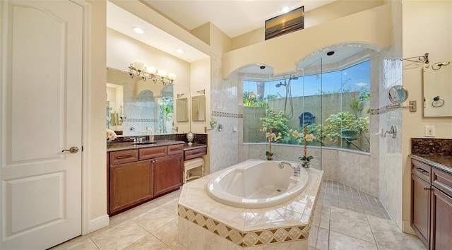 15110 Sundial Pl, Lakewood Ranch, FL 34202 - bathroom with vanity, a whirlpool tub, and a walk in shower