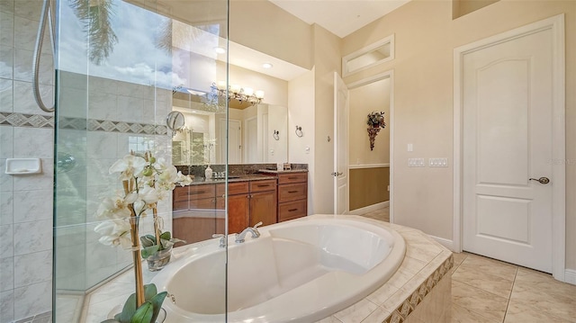 15110 Sundial Pl, Lakewood Ranch, FL 34202 - full bathroom with vanity, a garden tub, tile patterned flooring, and tiled shower