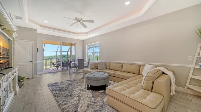 15110 Sundial Pl, Lakewood Ranch, FL 34202 - living area featuring a tray ceiling, a ceiling fan, light wood finished floors, and recessed lighting