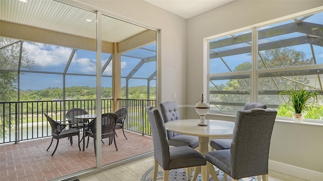 15110 Sundial Pl, Lakewood Ranch, FL 34202 - sunroom / solarium featuring outdoor dining space, plenty of natural light, and a water view