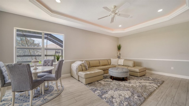 15110 Sundial Pl, Lakewood Ranch, FL 34202 - living area with a raised ceiling, light wood finished floors, a ceiling fan, and recessed lighting