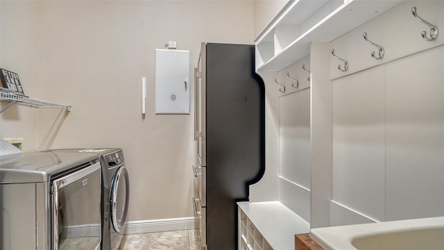 15110 Sundial Pl, Lakewood Ranch, FL 34202 - washroom featuring separate washer and dryer and light marble finish floors