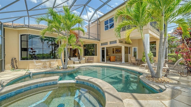 15110 Sundial Pl, Lakewood Ranch, FL 34202 - view of swimming pool with a patio area, a pool with connected hot tub, outdoor lounge area, and glass enclosure