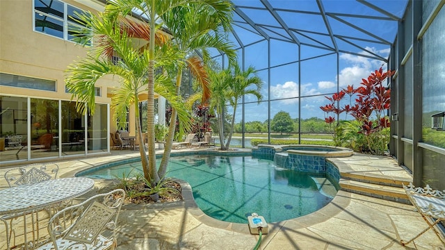 15110 Sundial Pl, Lakewood Ranch, FL 34202 - view of pool with glass enclosure, a patio, and a pool with connected hot tub