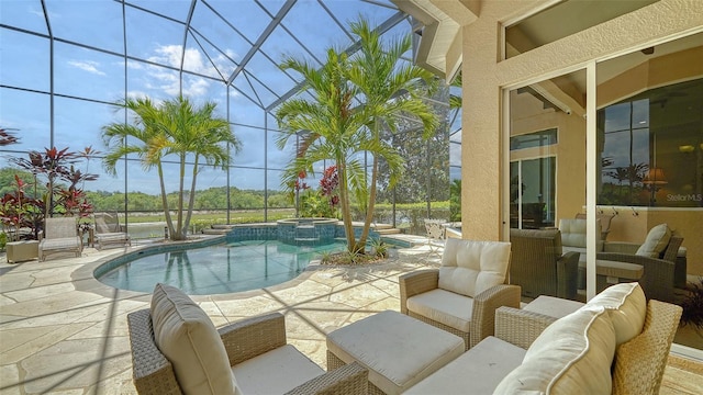 15110 Sundial Pl, Lakewood Ranch, FL 34202 - view of pool featuring a patio, glass enclosure, a pool with connected hot tub, and an outdoor hangout area