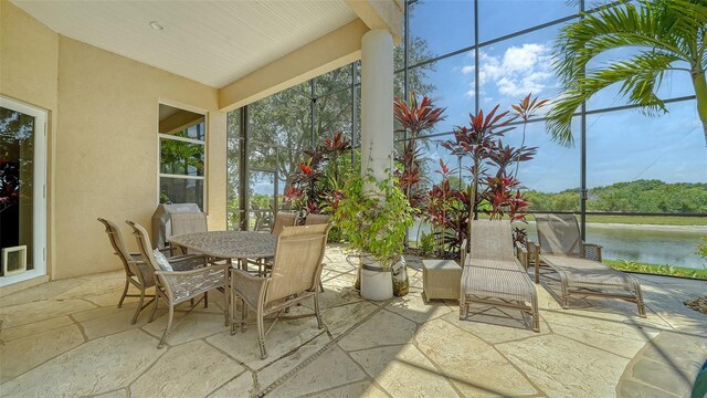 15110 Sundial Pl, Lakewood Ranch, FL 34202 - view of patio featuring a water view and outdoor dining space