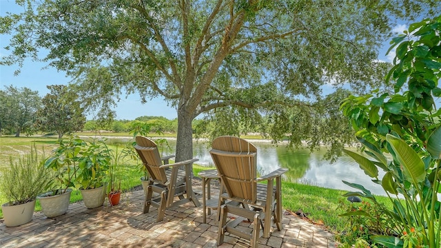 15110 Sundial Pl, Lakewood Ranch, FL 34202 - view of patio featuring a water view