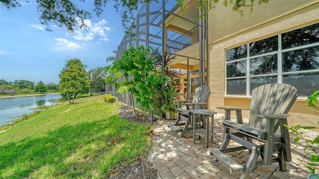 15110 Sundial Pl, Lakewood Ranch, FL 34202 - view of green lawn featuring a water view, a patio area, and glass enclosure