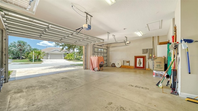 15110 Sundial Pl, Lakewood Ranch, FL 34202 - garage featuring a garage door opener and electric panel