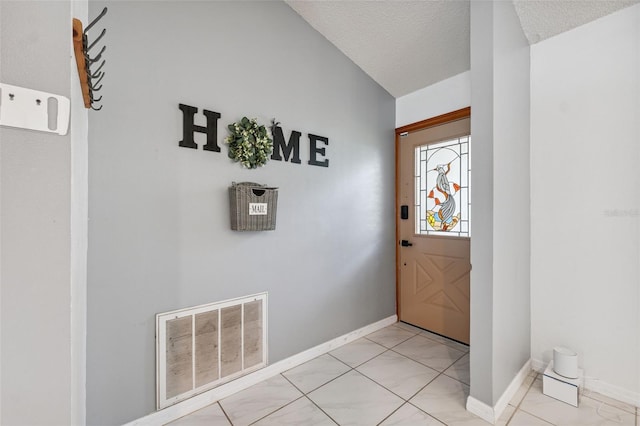 1116 Dagmar Ave, Spring Hill, FL 34606 - entrance foyer featuring a textured ceiling and lofted ceiling
