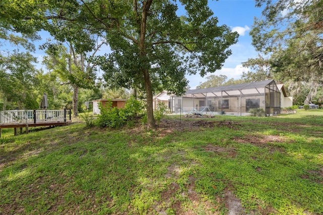 1116 Dagmar Ave, Spring Hill, FL 34606 - view of yard with a deck and glass enclosure