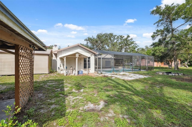 1116 Dagmar Ave, Spring Hill, FL 34606 - back of house featuring a lawn, an outdoor pool, and glass enclosure