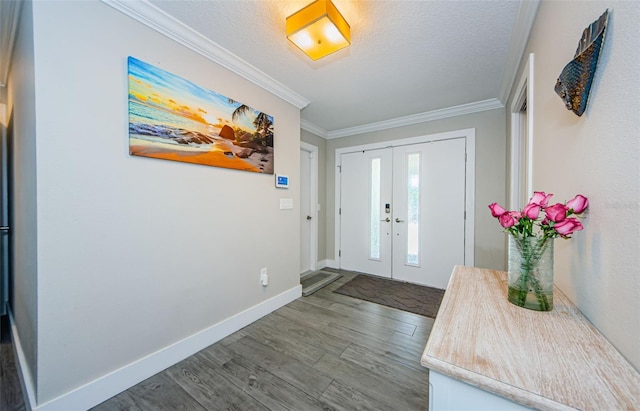 1120 Lancer Ln, Tarpon Springs, FL 34689 - foyer entrance featuring wood finished floors, ornamental molding, a textured ceiling, and french doors