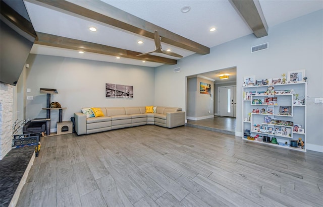 1120 Lancer Ln, Tarpon Springs, FL 34689 - living room featuring beam ceiling, wood finished floors, and recessed lighting