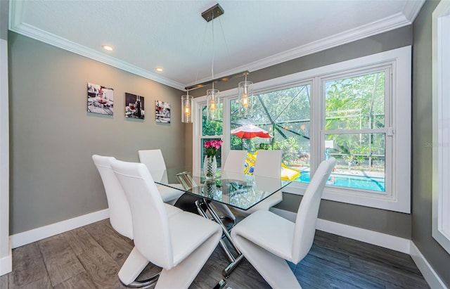 1120 Lancer Ln, Tarpon Springs, FL 34689 - dining space featuring ornamental molding, recessed lighting, and wood finished floors