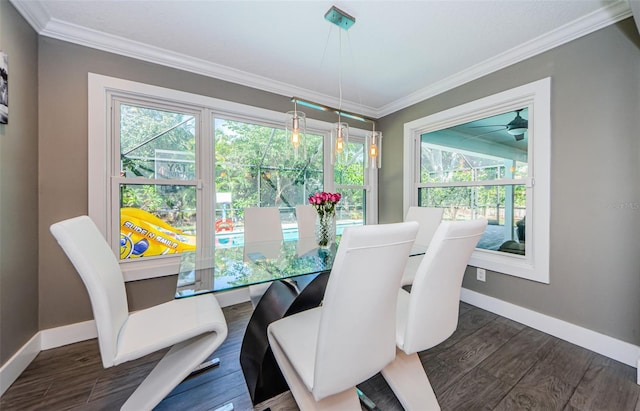1120 Lancer Ln, Tarpon Springs, FL 34689 - dining area featuring crown molding and dark wood-type flooring