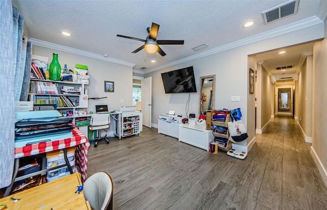 1120 Lancer Ln, Tarpon Springs, FL 34689 - office featuring wood finished floors, a ceiling fan, recessed lighting, ornamental molding, and a textured ceiling
