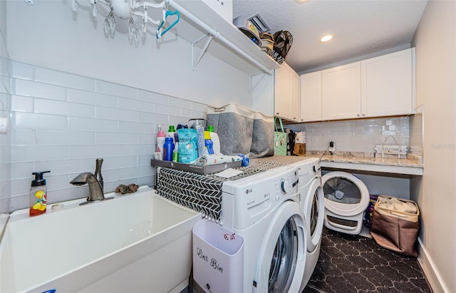 1120 Lancer Ln, Tarpon Springs, FL 34689 - laundry area featuring washing machine and clothes dryer, cabinet space, dark marble finish floors, and recessed lighting
