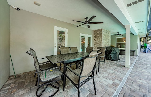 1120 Lancer Ln, Tarpon Springs, FL 34689 - view of patio featuring french doors, ceiling fan, and outdoor dining area