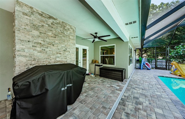 1120 Lancer Ln, Tarpon Springs, FL 34689 - view of patio / terrace with area for grilling, ceiling fan, french doors, and glass enclosure