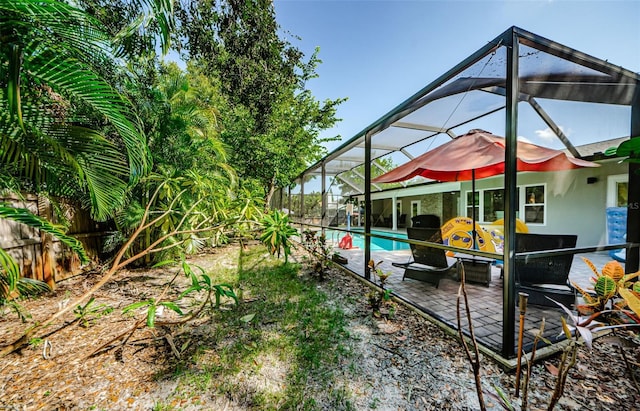 1120 Lancer Ln, Tarpon Springs, FL 34689 - view of yard with an outdoor pool, a patio area, and a lanai