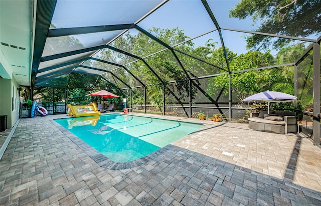 1120 Lancer Ln, Tarpon Springs, FL 34689 - swimming pool with a patio area and a lanai