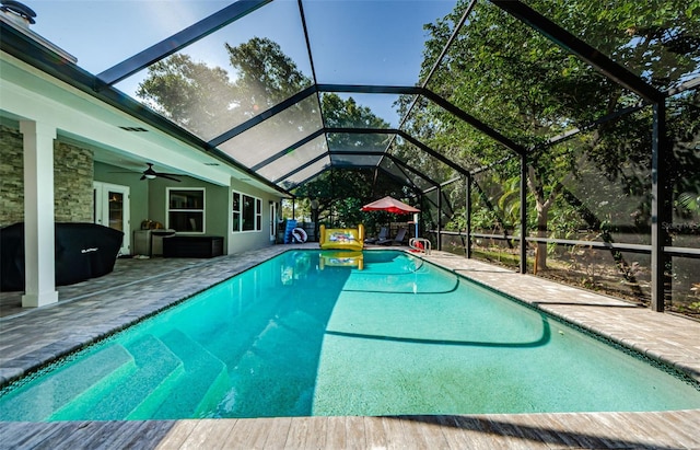 1120 Lancer Ln, Tarpon Springs, FL 34689 - swimming pool with a patio area, a lanai, and ceiling fan