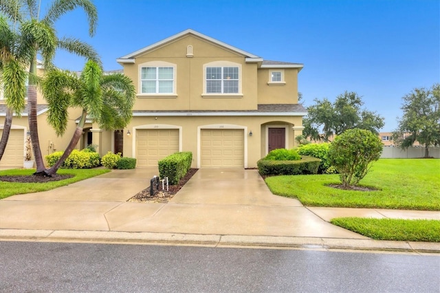11571 84th Street Cir E Unit 106, Parrish, FL 34219 - view of front of house featuring stucco siding, concrete driveway, an attached garage, and a front yard